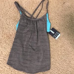 I am selling a DSG heather grey and blue women’s x small workout tank top.